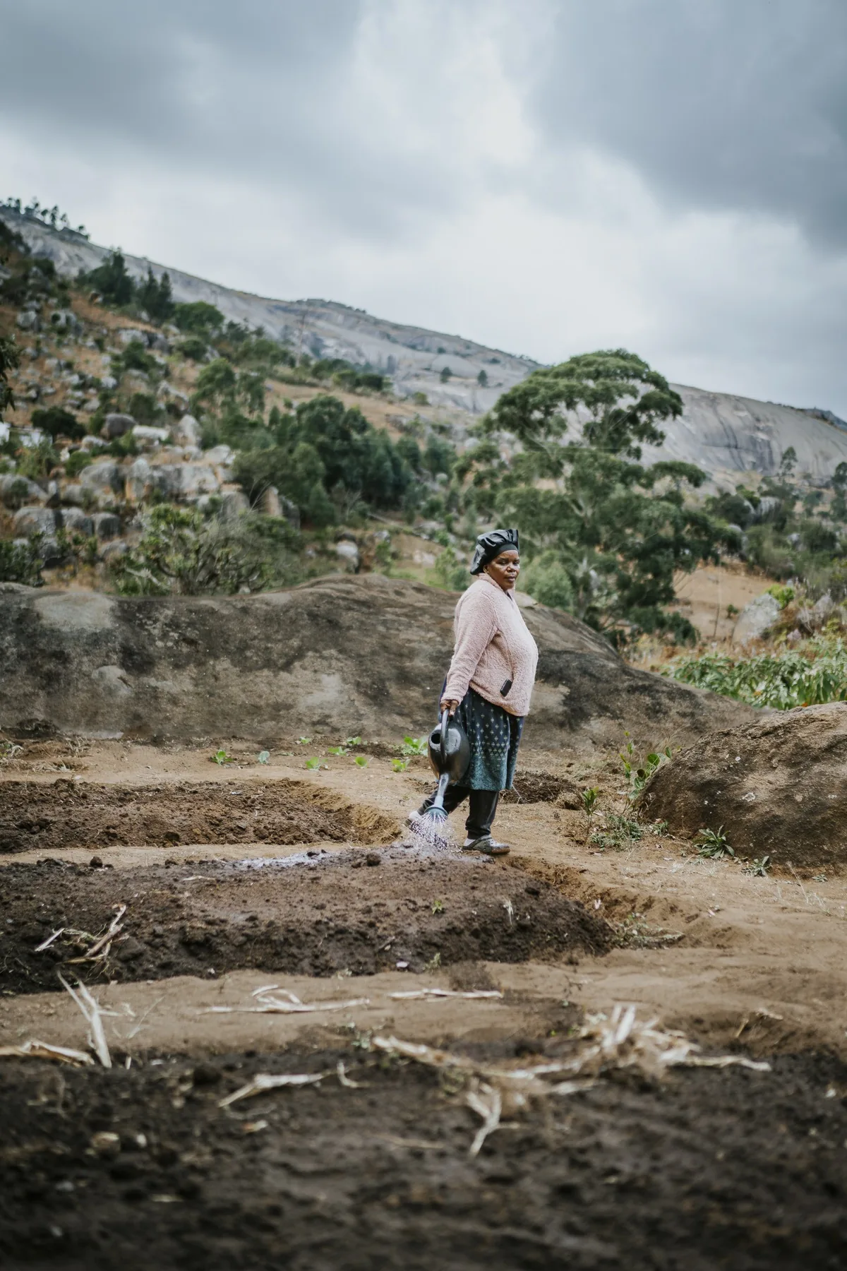 Woman tending her garden plot in Eswatini